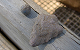 an arrowhead and a musket ball