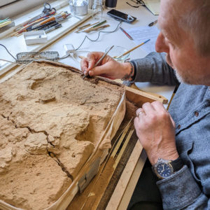 Senior Archaeological Conservator Dan Gamble conserving the church tower plaster.