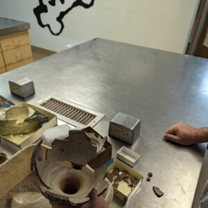 Archaeological Conservator Dr. Chris Wilkins shows the inside of the Bartmann jug he's been mending. The circles from the jug's throwing are easily discernible and are important clues during the mending process.