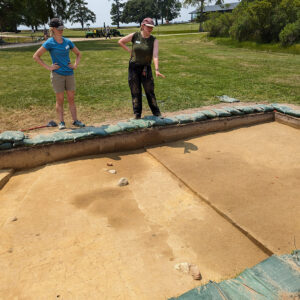 Field School student Eleanor Robb explains the progress made by her team at the north field excavations.