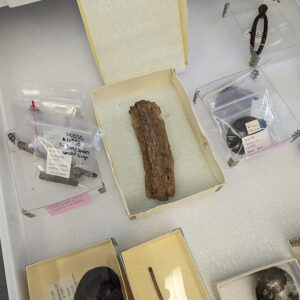 The ridge running along the center of this brown object is a spoon handle which is degraded to the point that further corrosion removal efforts might damage what's left of the original metal. Moving forward the plan is to stabilize the object to prevent further corrosion.