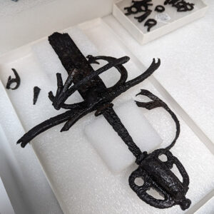 The partial sword from the Governor's Well that Conservator Don Warmke has finished conserving. It is now housed in the Vault's dry room, where temperature and humidity are regulated to inhibit corrosion.