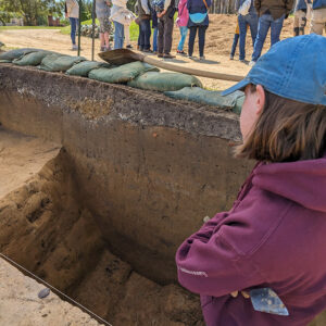 Staff Archaeologist Natalie Reid ponders the soil layers of the 1608 ditch.