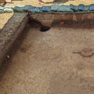 The outline of a child's burial found in the excavations south of the Archaearium.