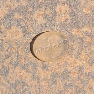 An unknown object debossed with the name "Dr. Franklin" found in the southern Smithfield excavations