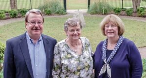 Senior Curator Merry Outlaw with Jim and Pam Penny