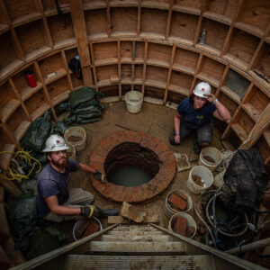 Archaeologists Josh Barber and Hannah Barch at the Governor's Well