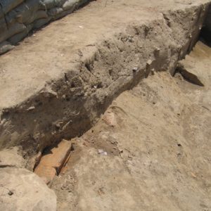 Excavation unit lined with sandbags