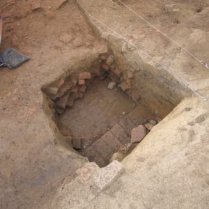 Exposed bricks within an excavation unit