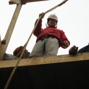 Archaeologist standing at top of well