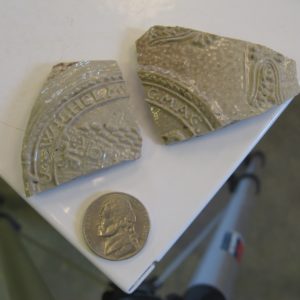 Salt-glazed stoneware sherds on a table