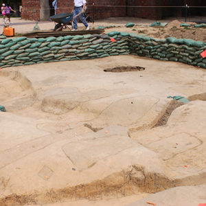 Excavation unit lined with sandbags