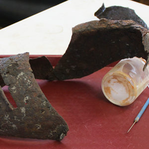 conserved close helmet and empty bottle of solution on a tray