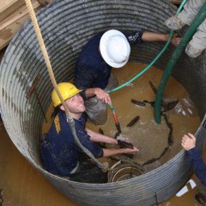 Archaeologists excavate well