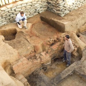 Aerial view of archaeologists examining excavations