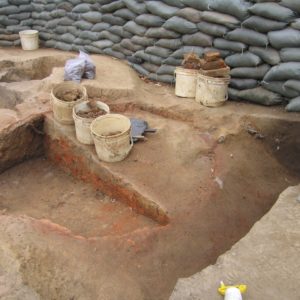 Excavation unit lined with sandbags