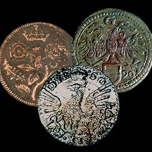 three copper alloy tokens