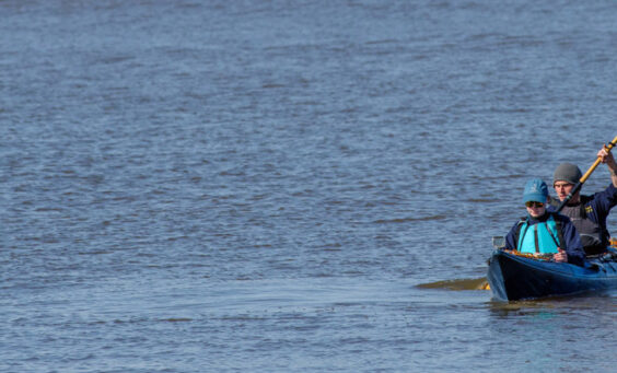 Staff Archaeologists Natalie Reid and Gabriel Brown returning from their GPR survey across the James River.