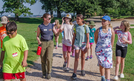 Staff Archaeologist Natalie Reid leads a tour of Jamestown on the first day of Kids Camp.