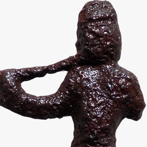 Copper alloy pipe tamp in figure of a man holding a long pipe