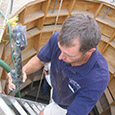 Archaeologist Danny Schmidt carries the pistol to the surface