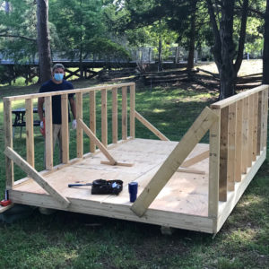 Staff building wooden shed