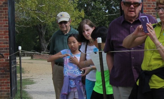 Archaeologist speaks to a group of visitors