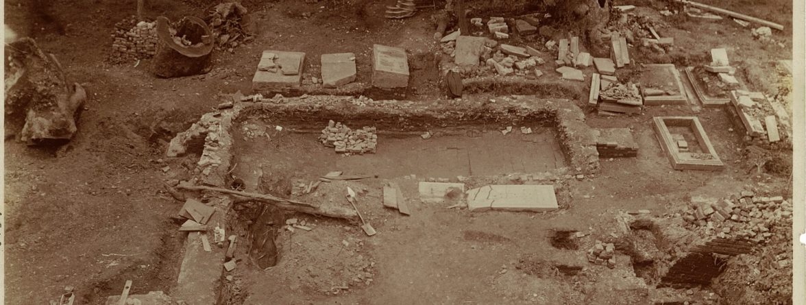 sepia photograph of churchyard excavations