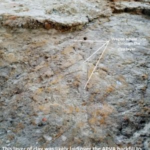 Notated wheel ruts in excavated floor